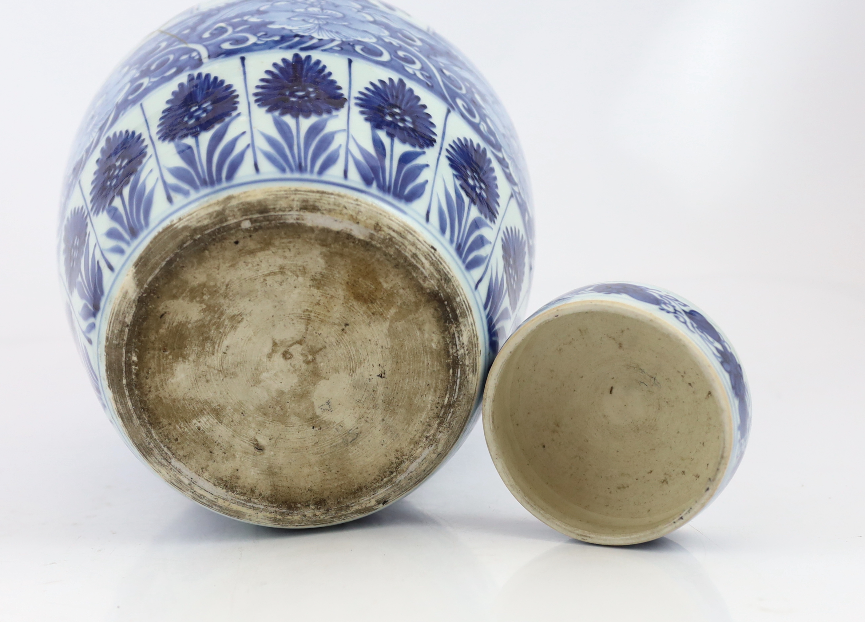 A Chinese blue and white ovoid jar and cover, Kangxi period, broken with kintsugi repair